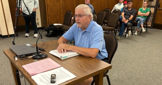 Hall County Rural Transportation Manager Bob McFarland talks to Hall County Commissioners June 30 concerning continuation of the service. A public hearing followed McFarland's introductory comments. (Carol Bryant, Central Nebraska Today)
