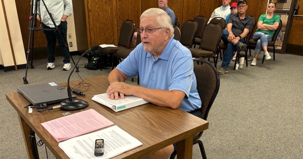 Hall County Rural Transportation Manager Bob McFarland talks to Hall County Commissioners June 30 concerning continuation of the service. A public hearing followed McFarland's introductory comments. (Carol Bryant, Central Nebraska Today)