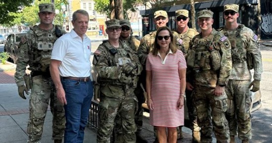 Gov. Pillen & First Lady Suzanne pose with National Guard members in D.C.